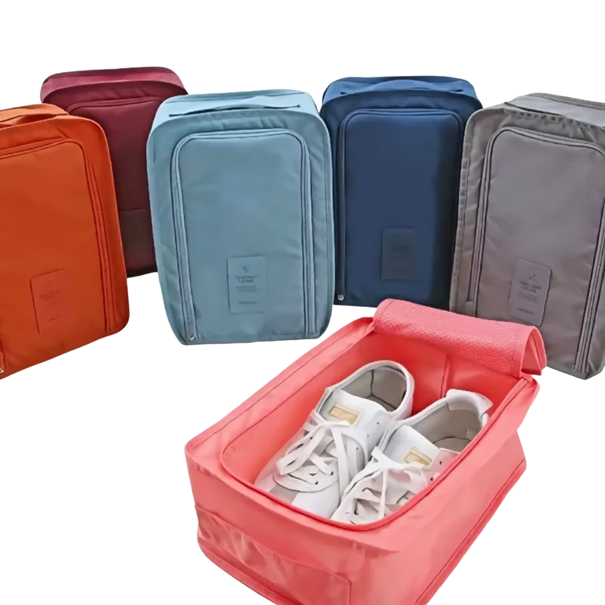 Pink waterproof travel shoe storage bag for women with zipper closure and soft fabric exterior portable organizer