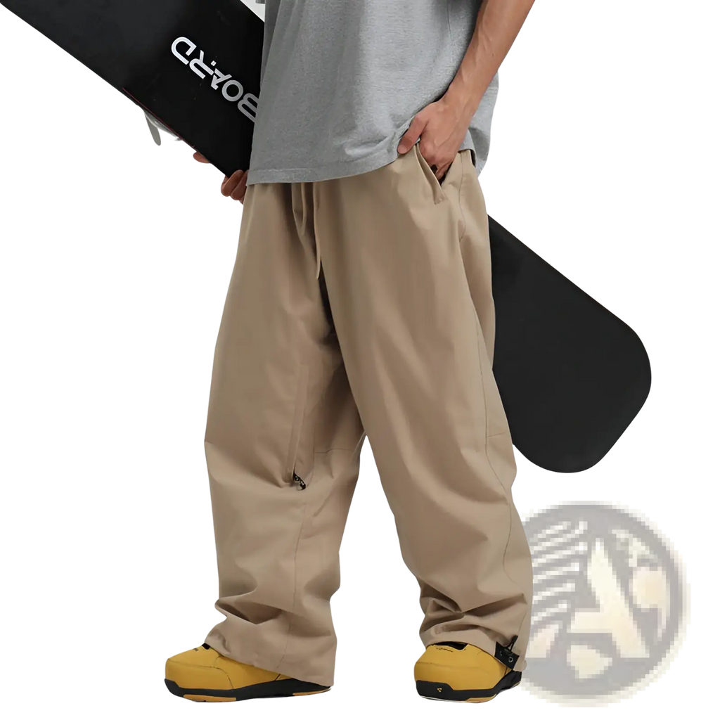Beige waterproof windproof snow pants with a relaxed fit zippered pockets and adjustable ankle straps for work or outdoor use