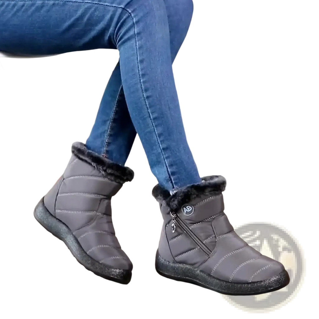 Waterproof gray quilted winter snow boots with black rubber soles and plush faux fur lining for cold weather use