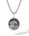 Silver wave pendant necklace with detailed wave design in oval frame on matching silver box chain