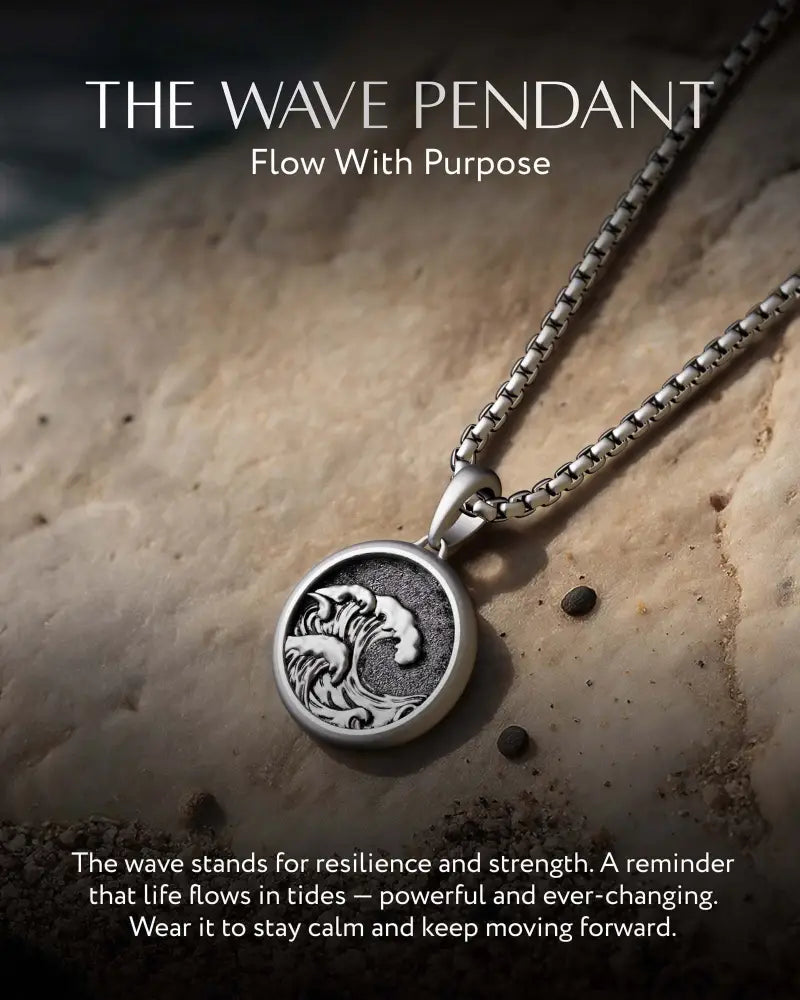 Silver wave pendant engraved with intricate oceanic design on a matching silver box chain necklace
