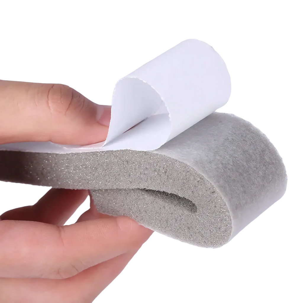 Gray foam adhesive weather stripping tape with white paper backing for doors and windows sealing applications