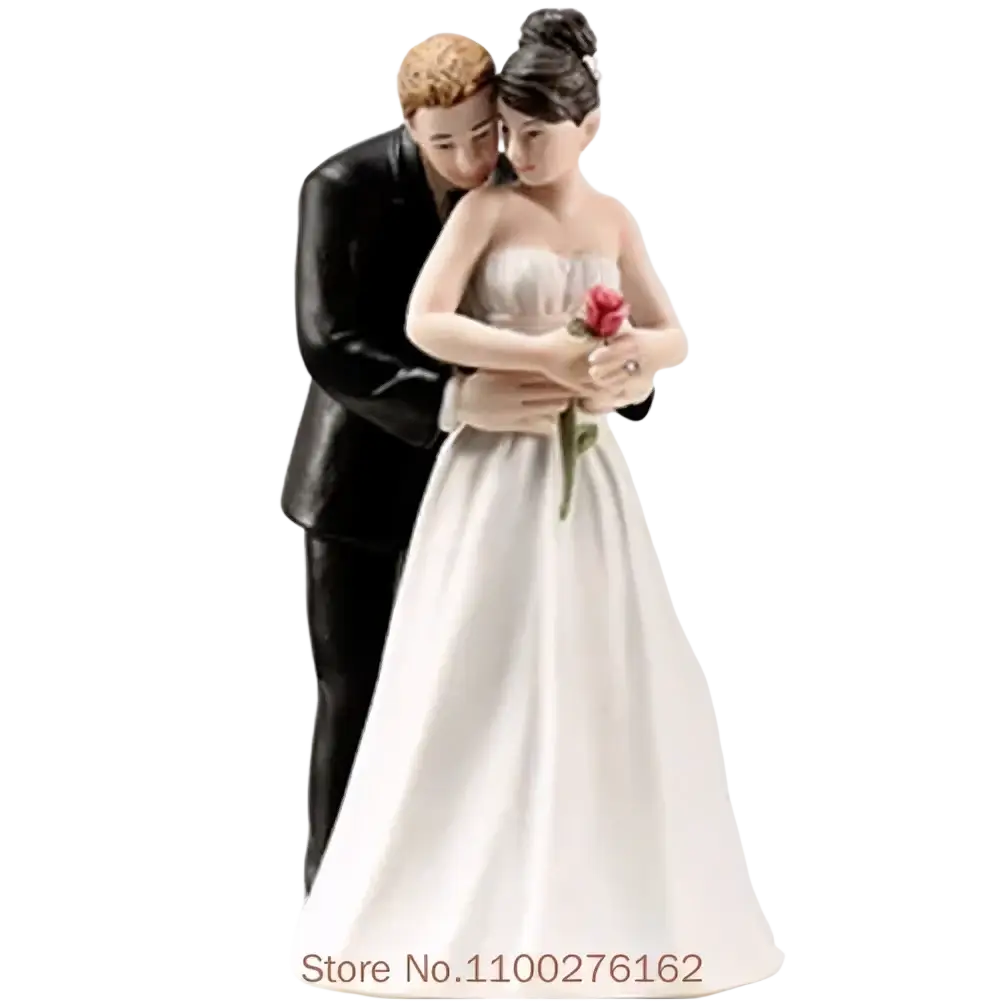White and black resin wedding cake topper of bride and groom figurine with bride holding a red rose