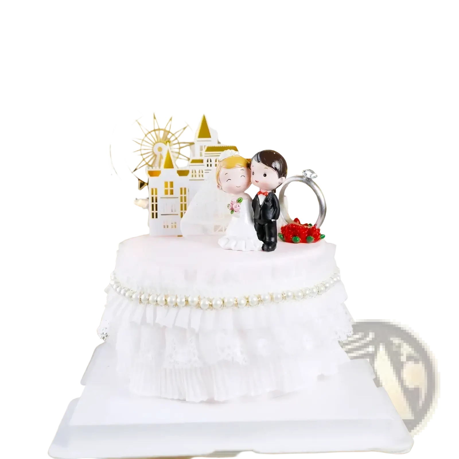 White wedding cake topper featuring acrylic bride and groom figurine with gold castle and ferris wheel decor