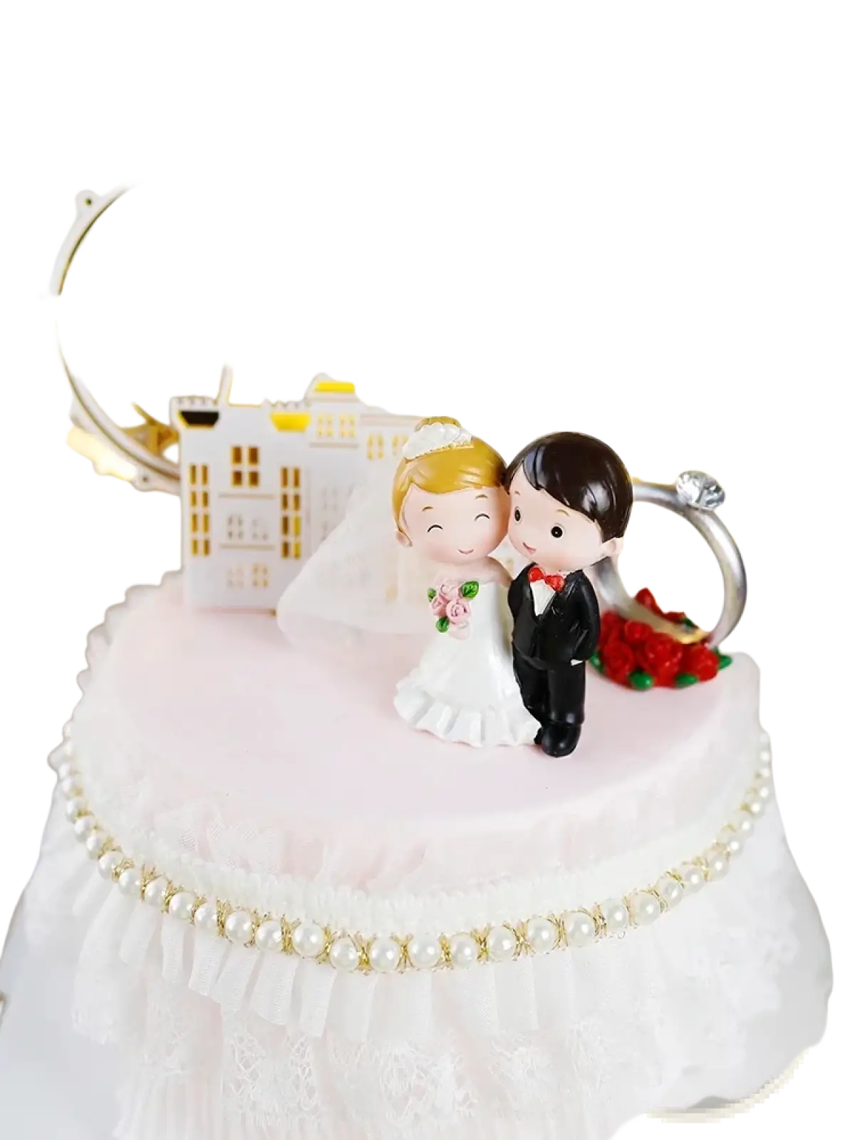 White and gold wedding cake topper featuring a cartoon bride and groom figurine with pearl trim acrylic decor