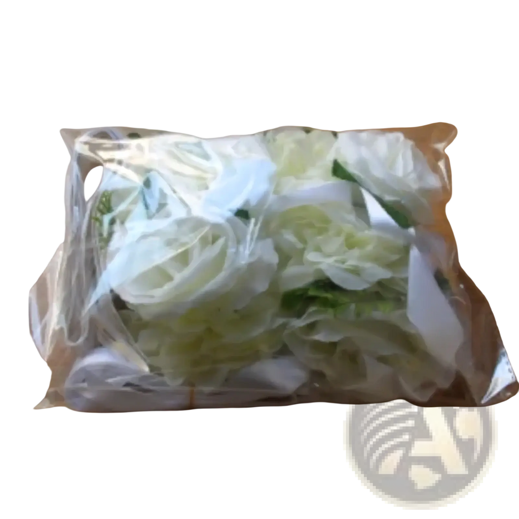 A package of artificial white and light green roses wrapped in clear plastic for wedding car decoration