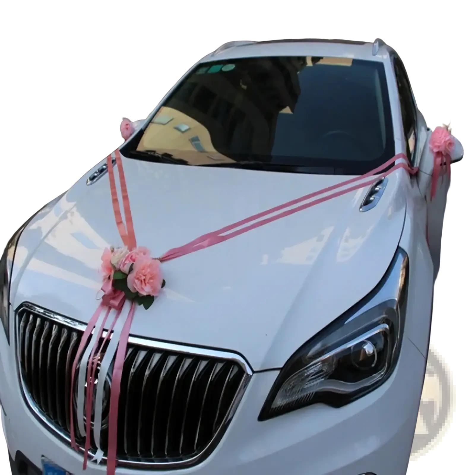 A white Buick sedan decorated with pink and silver ribbon bows and artificial flowers for wedding use