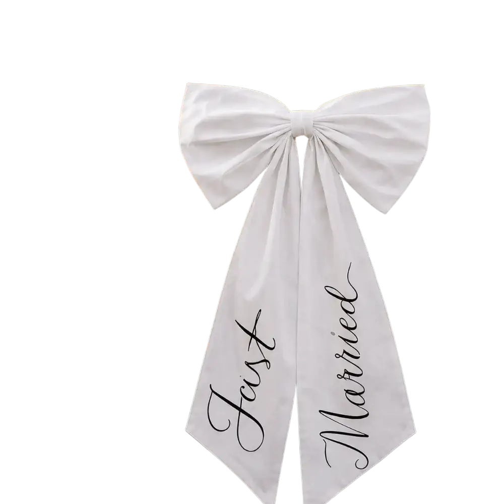 White satin wedding car bow with just married black cursive script tied to front of luxury vehicle decoration
