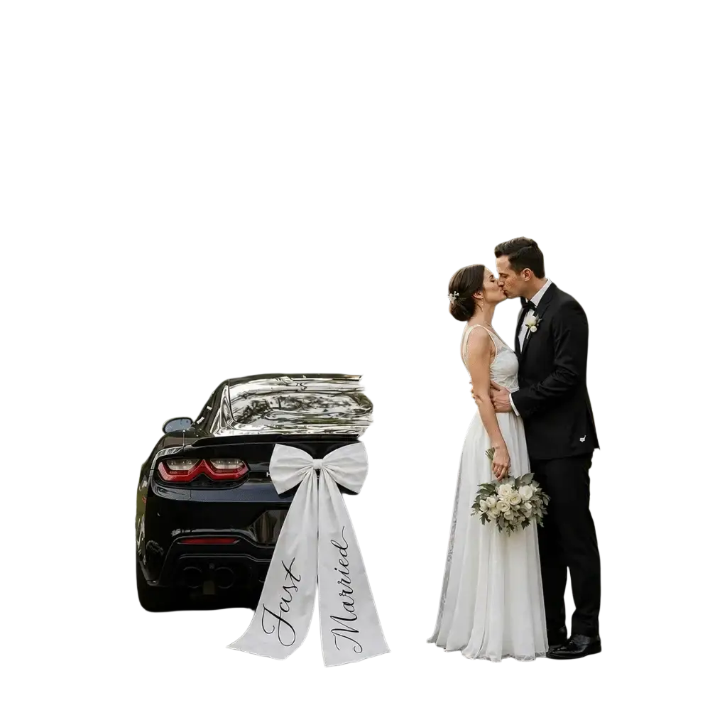 Back view of black Chevrolet Camaro decorated with large white satin wedding car bow and just married ribbon