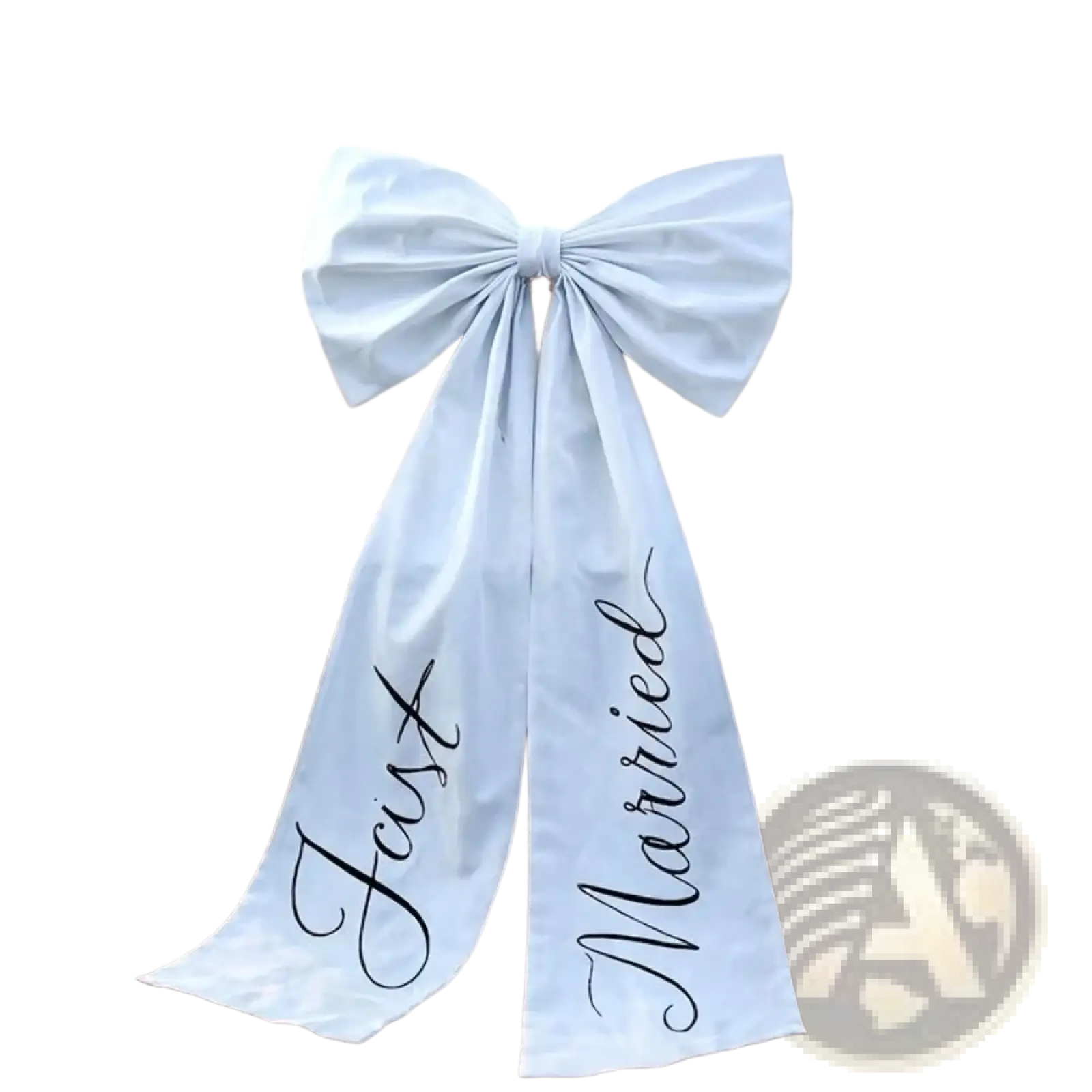 A light blue satin wedding car bow tied across the rear of a vintage white car with just married scripted in black cursive