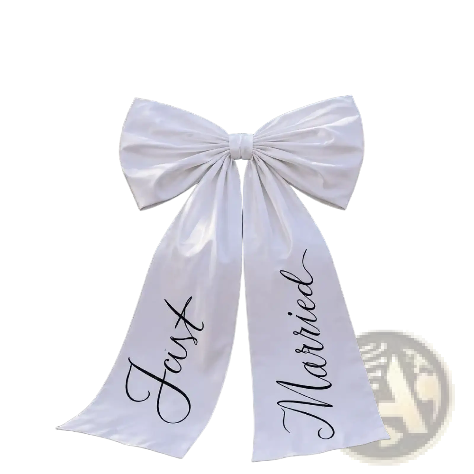 A large white satin wedding car bow with just married scripted in black cursive on the hood of a car