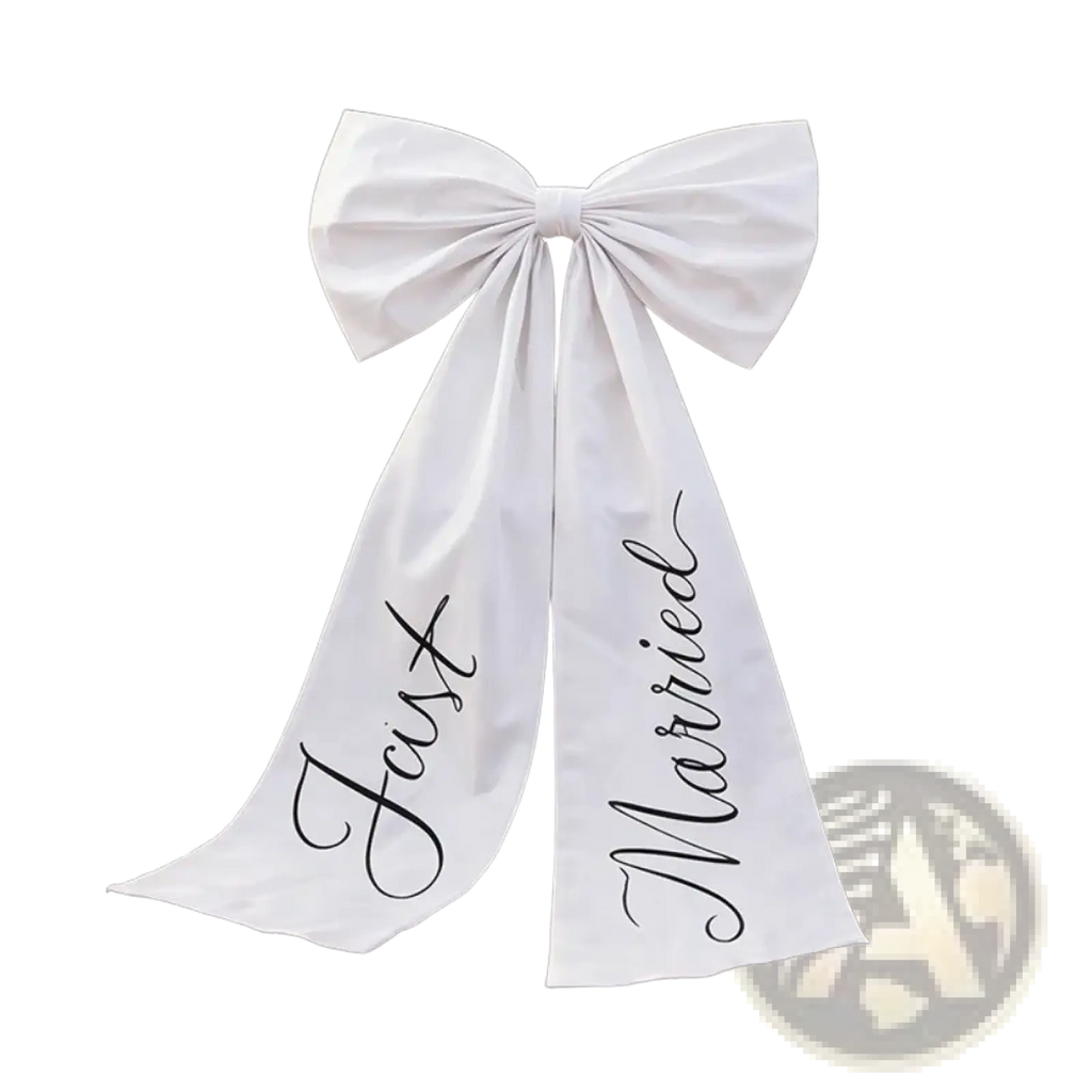 White satin wedding car bow with just married black cursive script on each tail for wedding decoration
