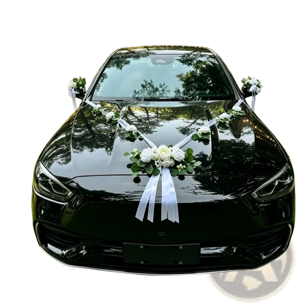 Black glossy sedan decorated with white artificial rose and eucalyptus flower arrangements and ribbons for weddings
