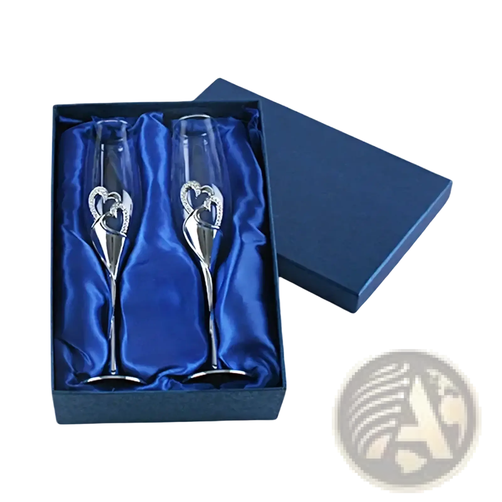 A pair of elegant silver champagne flutes with gold heart designs in a blue satin-lined wedding gift box