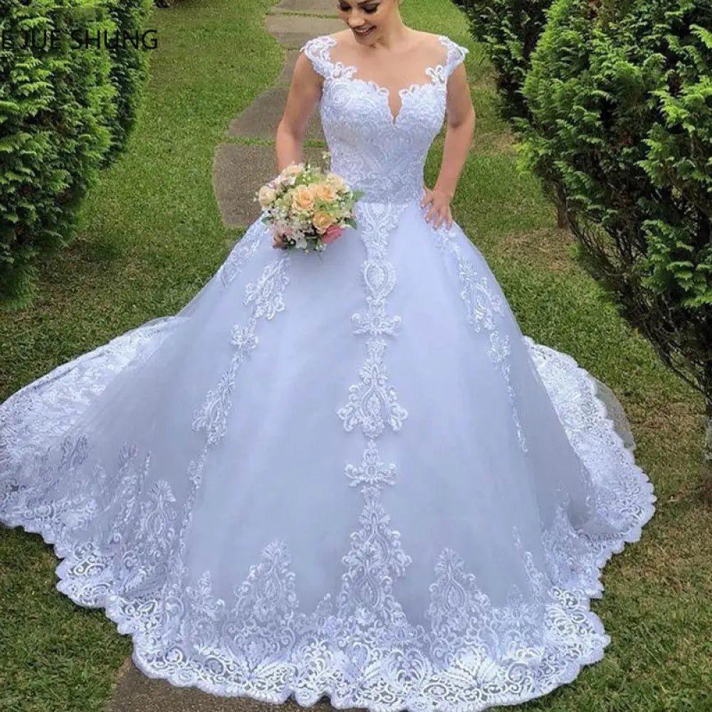 Vintage white lace off-the-shoulder wedding gown with delicate lavender fabric and intricate white lace detailing