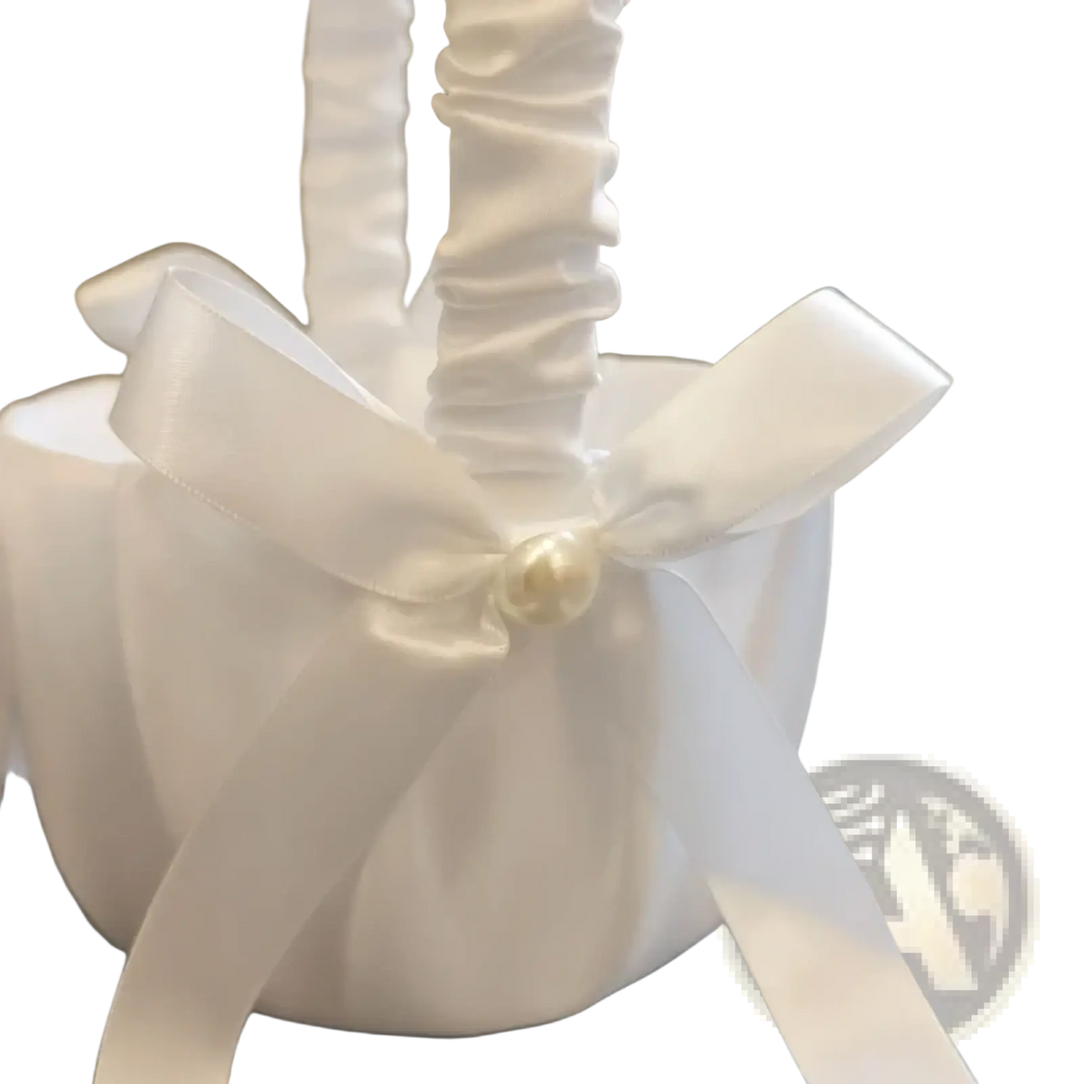 White satin ribbon wedding flower basket adorned with a pearl center for elegant ring pillow set use