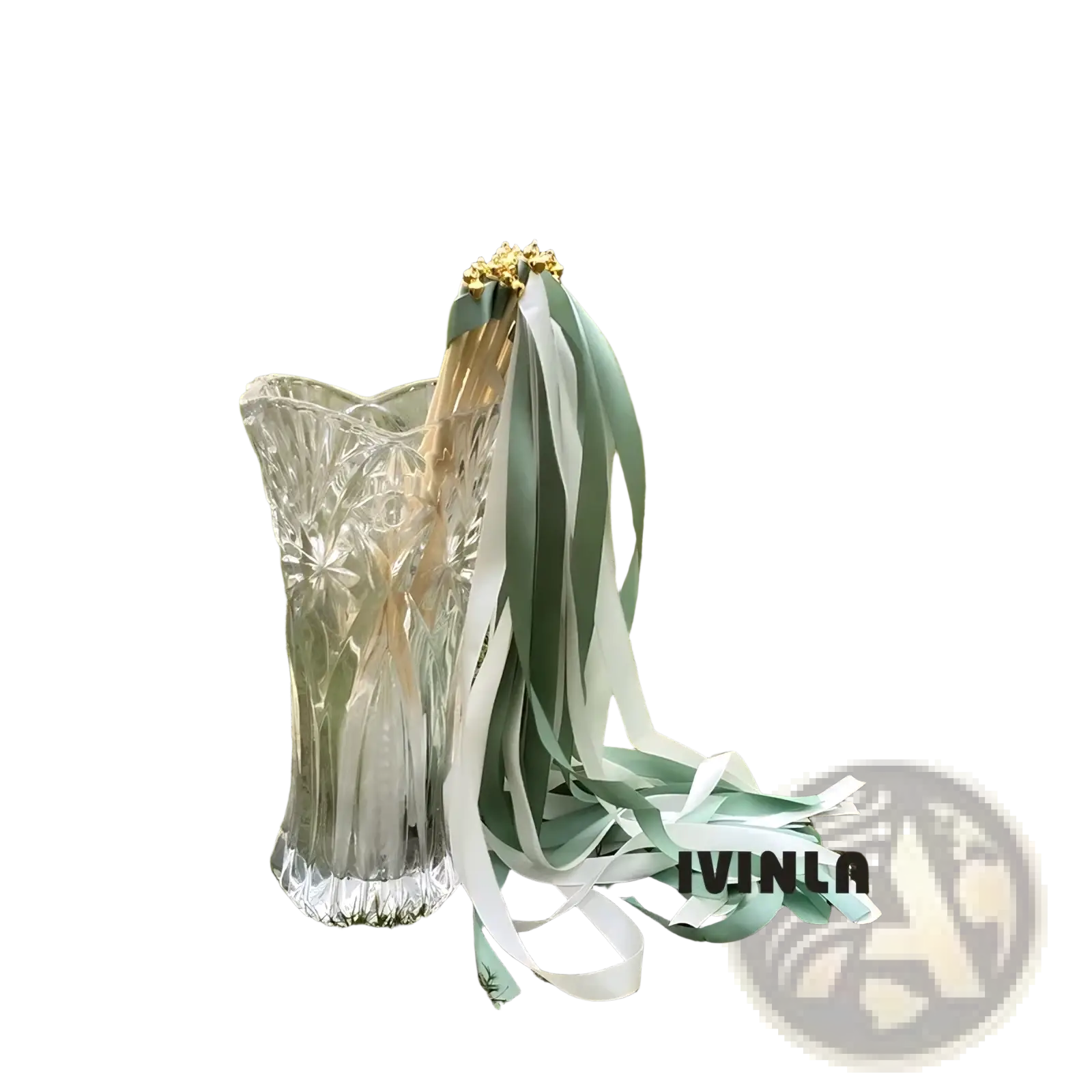 A clear glass vase with fluted design holds delicate golden flowers and soft mint green and white wedding ribbon wands