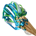 A vibrant bouquet of blue and green satin ribbon wedding wands with gold bells by Romeda in a 50 pack