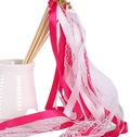 Wedding ribbon wand with vibrant pink and white satin ribbons intertwined with delicate lace and golden embellishment