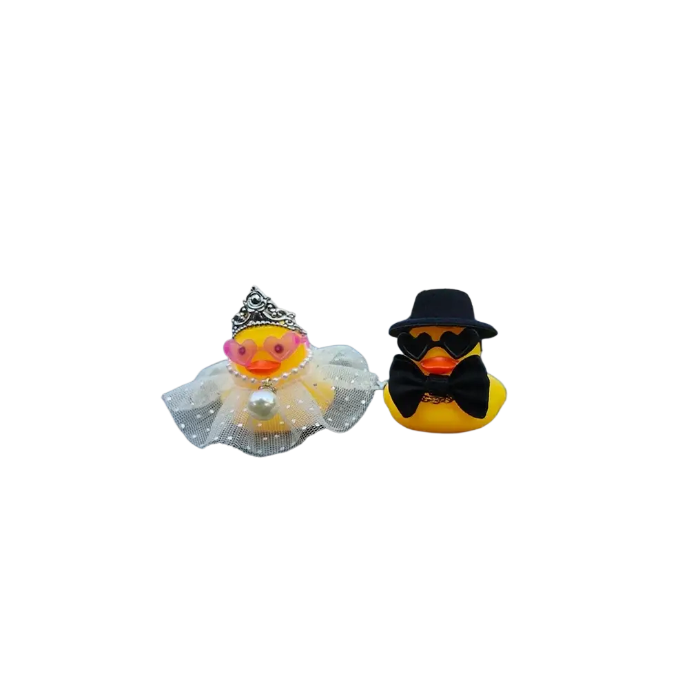 Two yellow rubber duck figurines dressed as a bride and groom wedding rubber duck car dashboard couple ornament