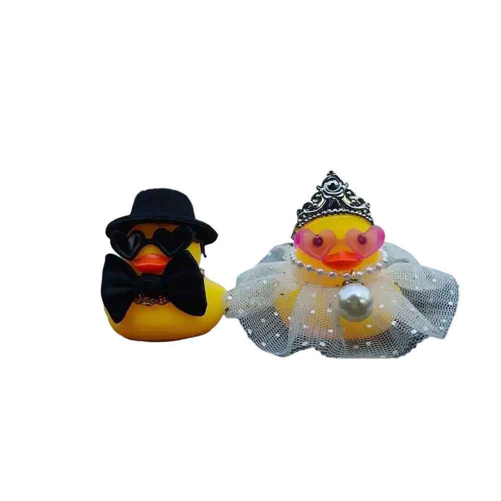Yellow rubber duck couple car dashboard ornament featuring wedding attire with top hat tiara and heart-shaped glasses