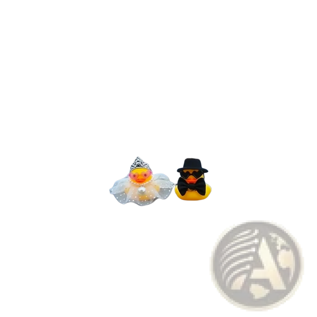 A charming yellow rubber duck wedding car dashboard couple ornament with groom in black hat and bride in tiara veil