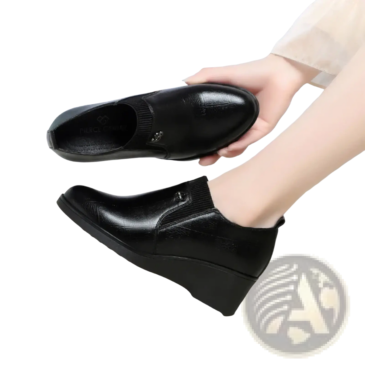 Black leather wedge ankle boots with ribbed elastic side panels and a small metallic buckle detail for women