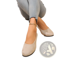 Beige wedge flats with crocodile embossed patent leather texture and black rubber soles for comfortable wear