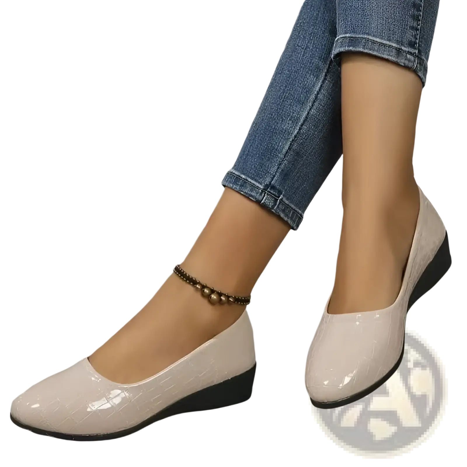 Beige wedge flats crocodile embossed patent leather shoes with black soles showing the back side of the product
