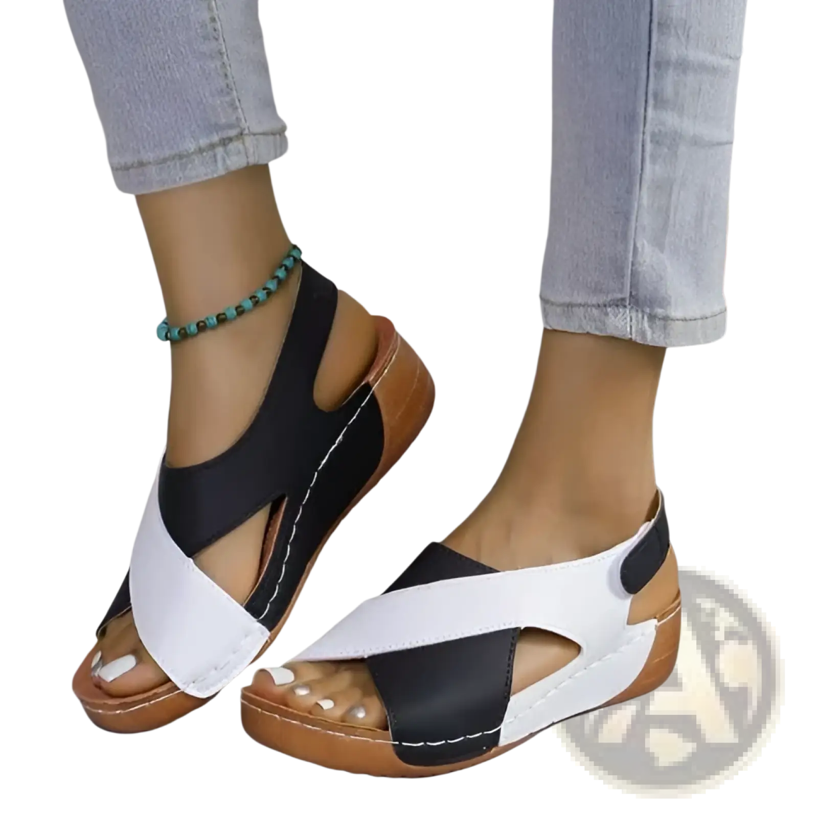 Black and white cross-strap wedge sandals with tan soles featuring colorblock platform design for stylish wear
