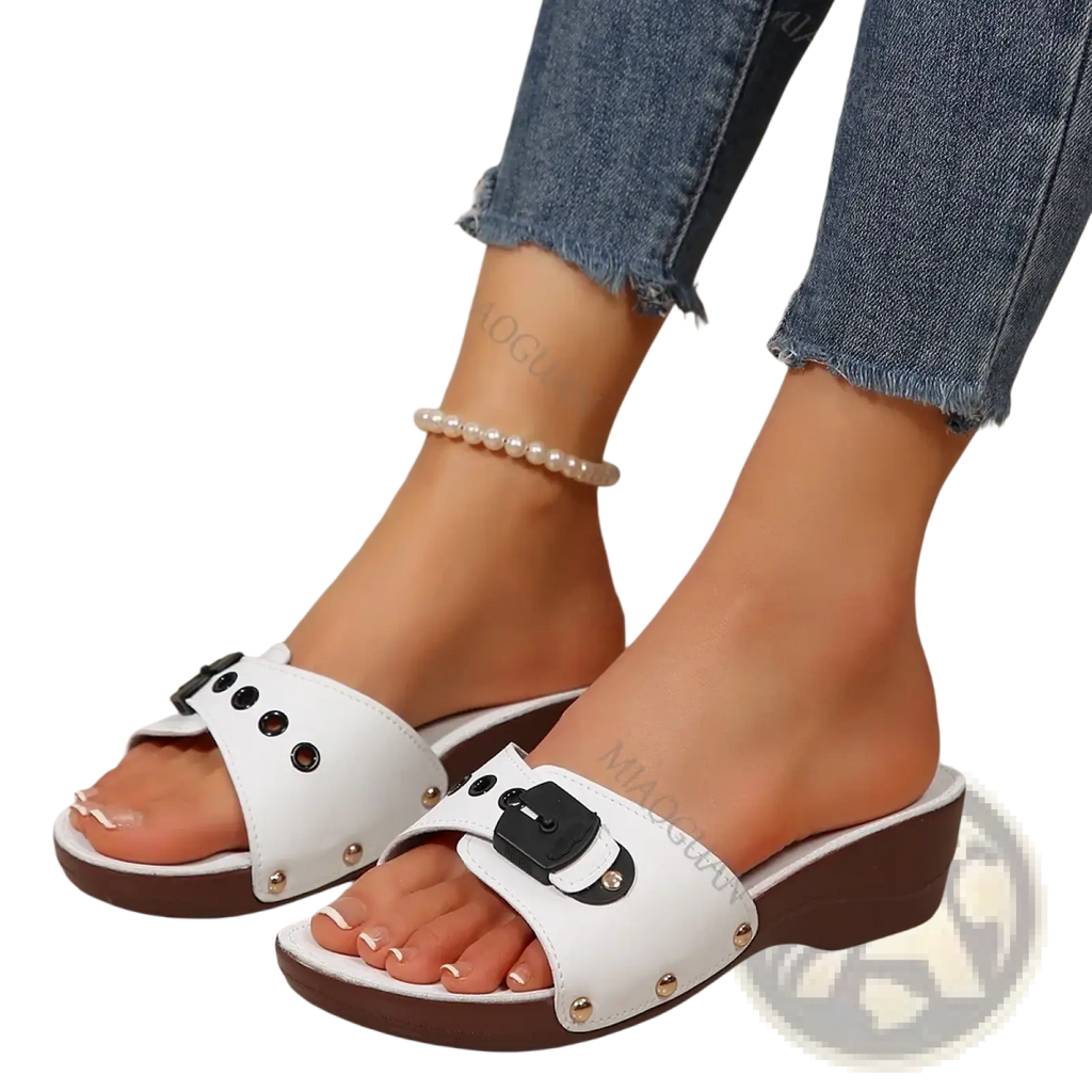 White leather wedge sandals for women with black buckle accents and brown platform soles for summer casual wear