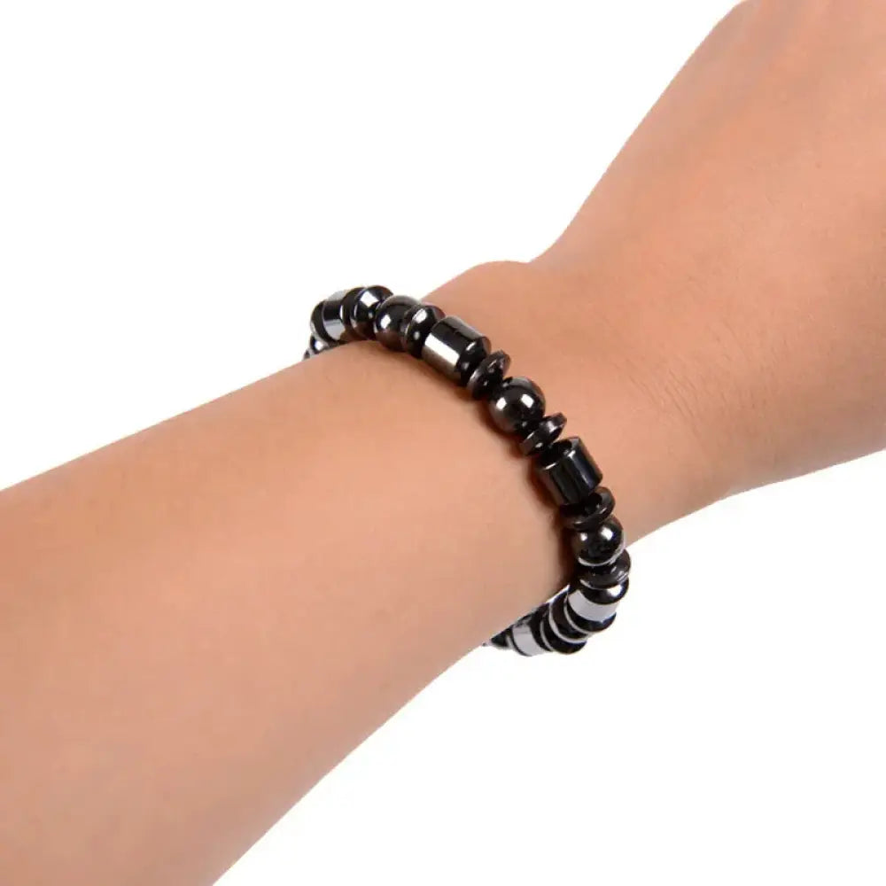 Black magnetic hematite therapy bracelet with alternating round and rectangular polished stones pentagram design