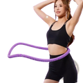 Weighted spring hula hoop in purple with textured, flexible design for easy spinning and core fitness exercises