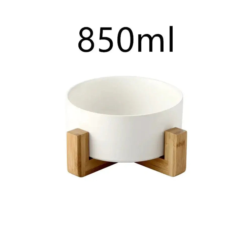 Minimalist matte white ceramic bowl with 850ml capacity supported by light brown bamboo wooden stand legs