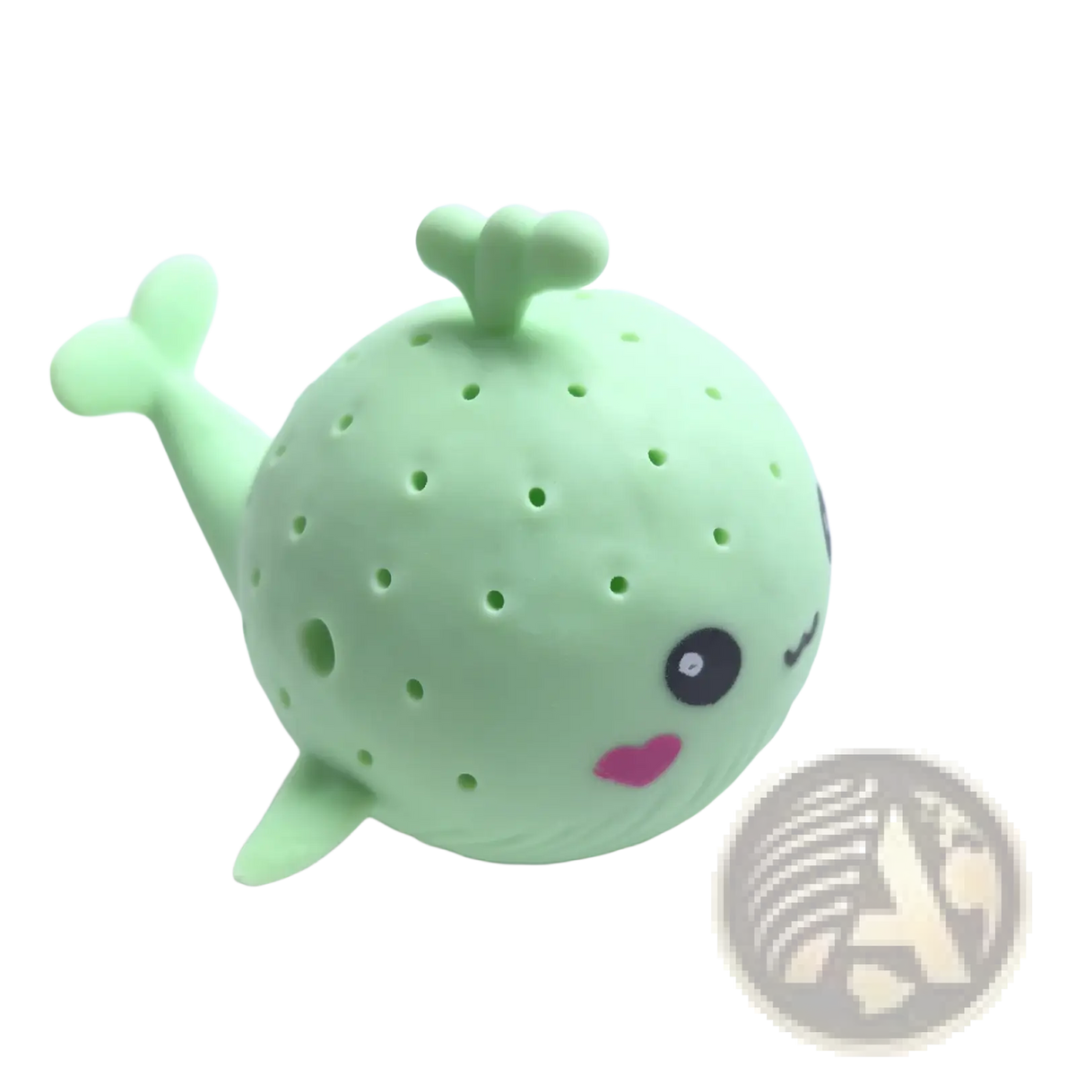 A cute light green silicone whale-shaped tea infuser with dotted pattern and pink heart mouth for kids bath toys