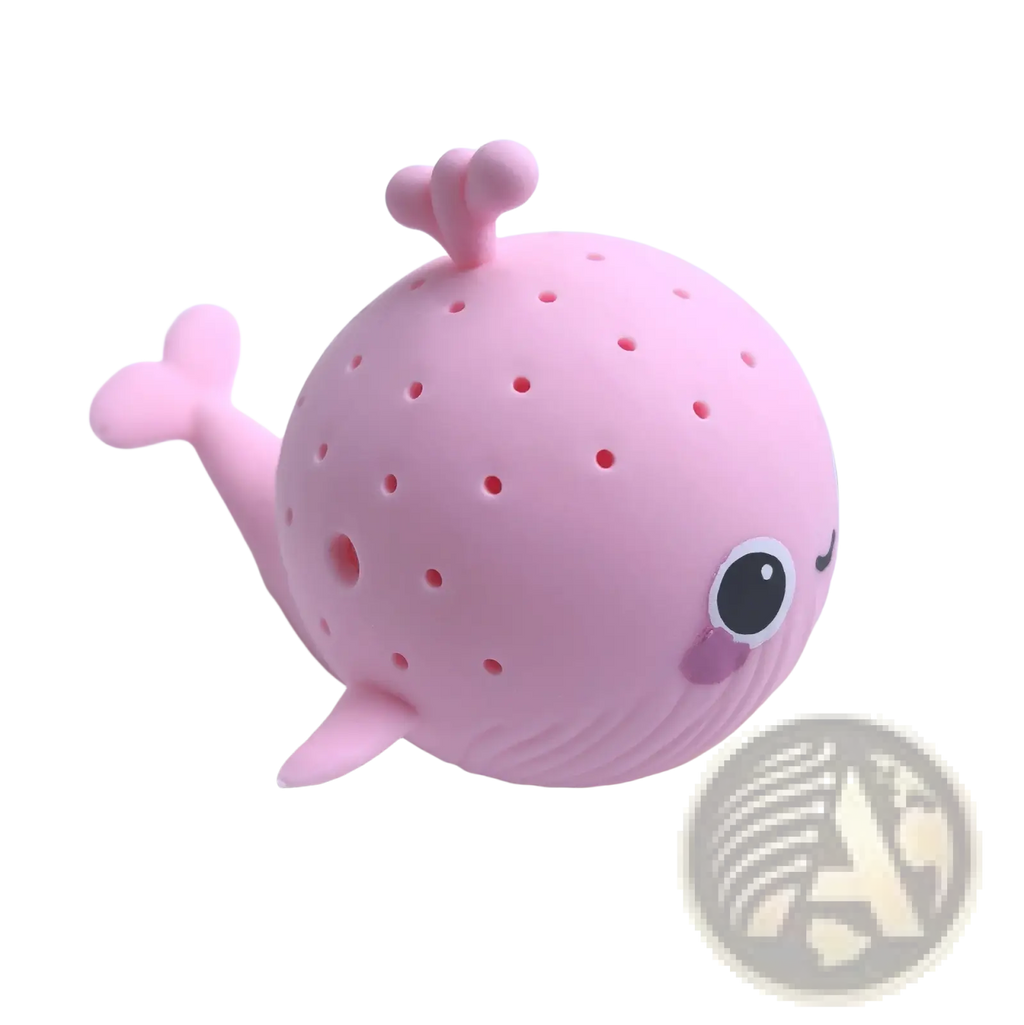 Pink silicone whale-shaped tea infuser with perforated body and cute facial features for kids bath sponge toys
