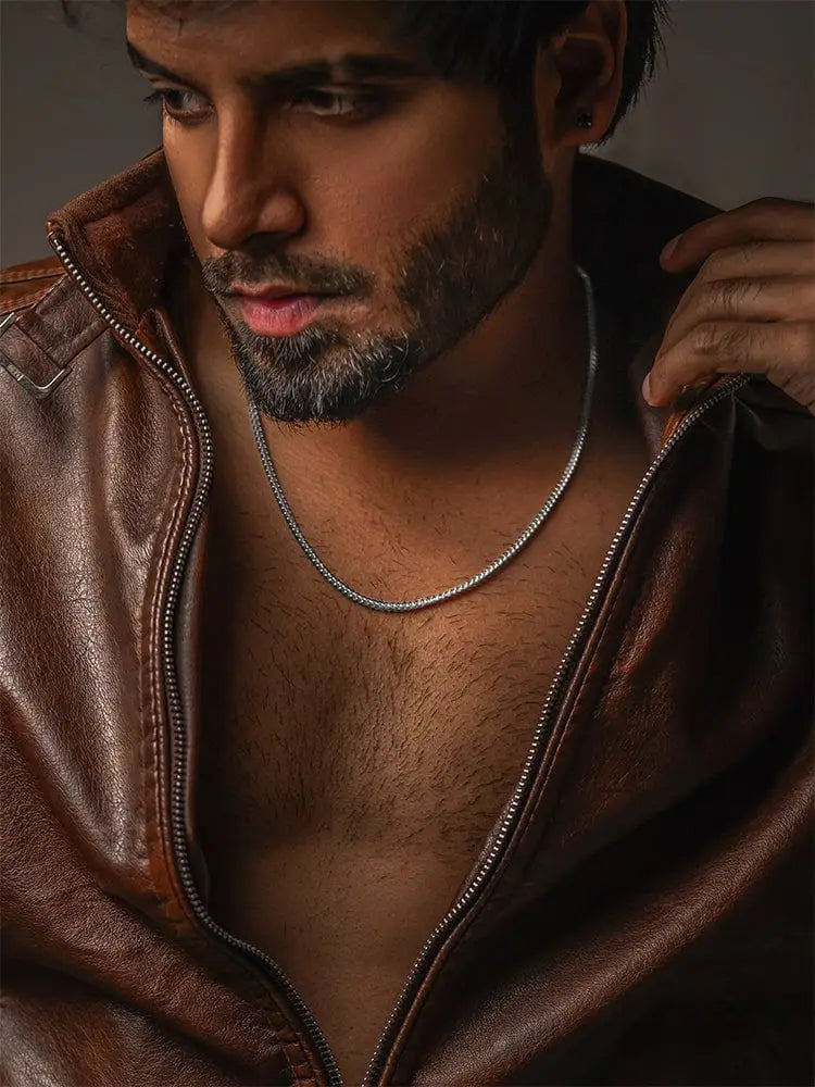 Silver 2.5mm wheat chain stainless steel necklace with sleek textured links worn against the skin