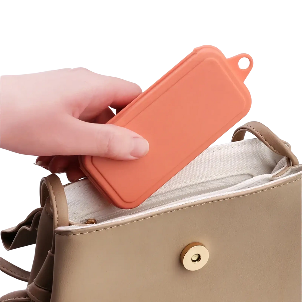 Orange silicone phone case with loop handle designed for wheat straw portable travel cutlery set storage and transport