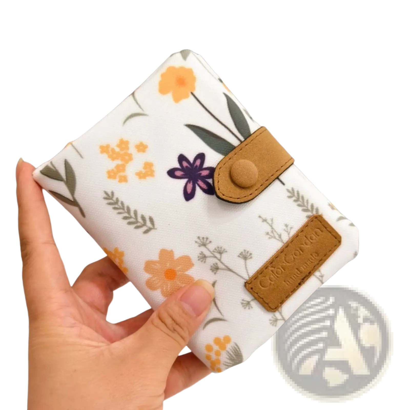 Whimsical patterned canvas tri fold multi card wallet with white floral pattern tan leather accents and button closure