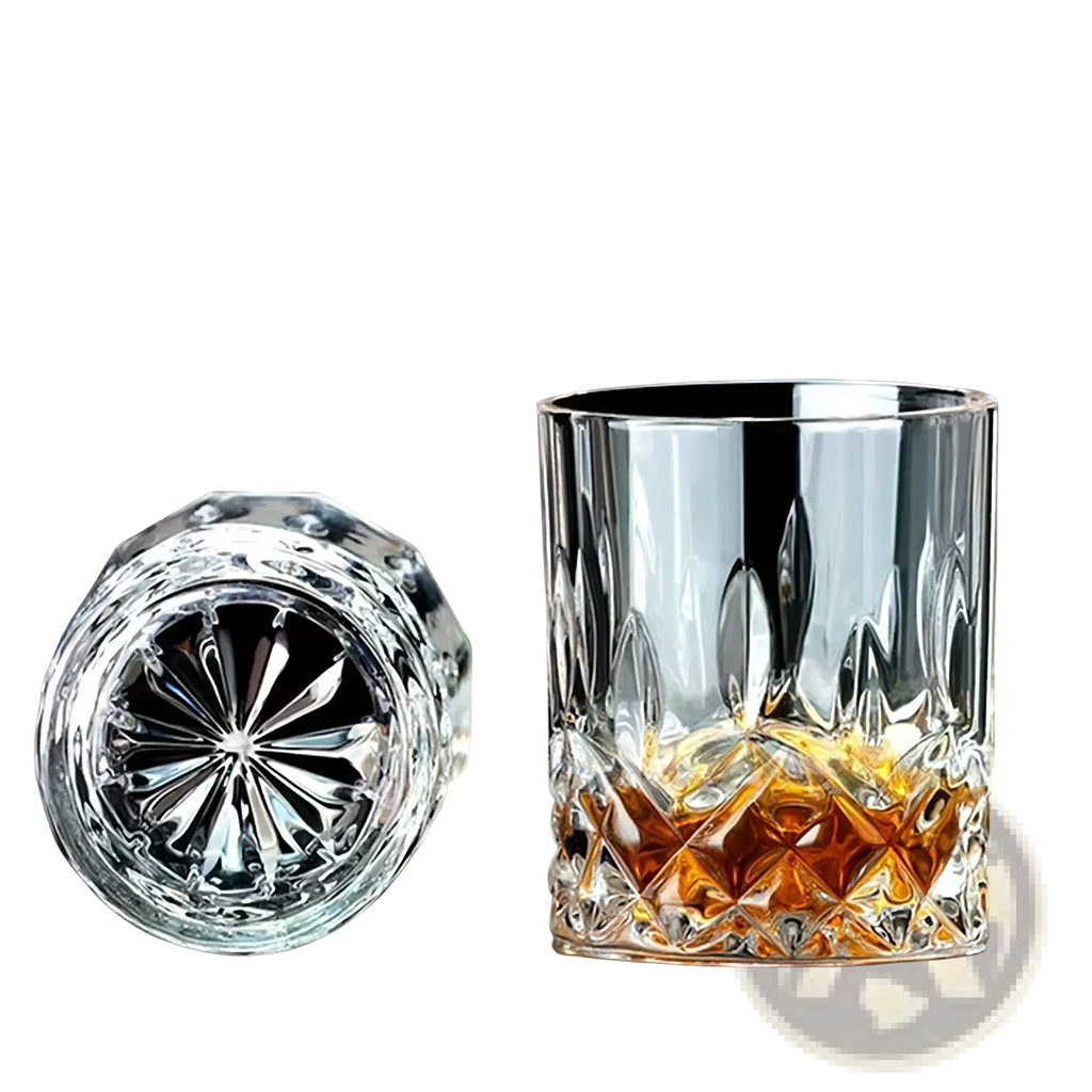 A double old-fashioned crystal whiskey glass with intricate faceted cuts in a whiskey stones gift set with wooden box