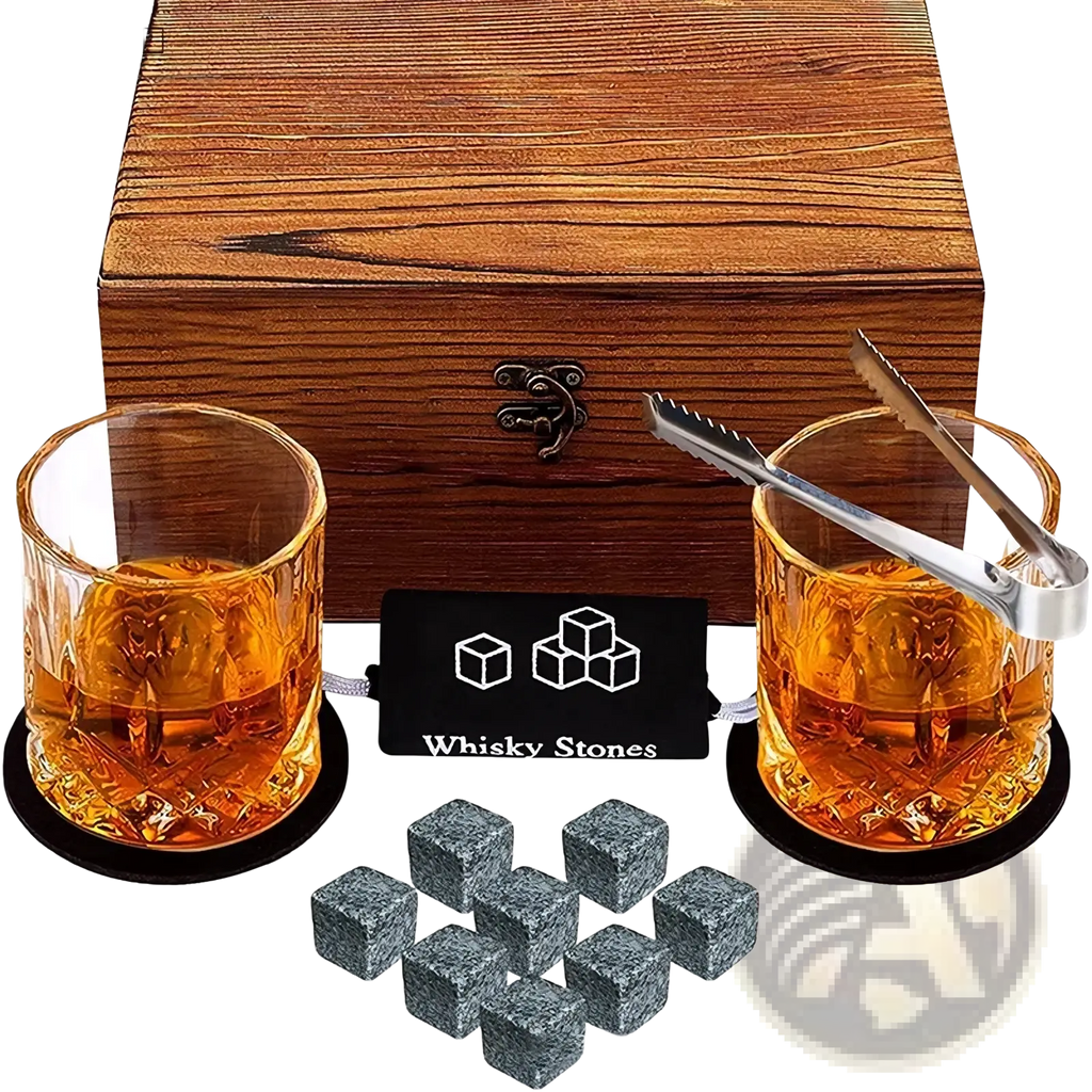 Whiskey stones gift set with eight gray stone cubes wooden box and two textured glass tumblers with amber whisky and ice