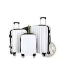 Set of three white hard shell spinner suitcases with black trim and wheels in a 3 piece luggage set
