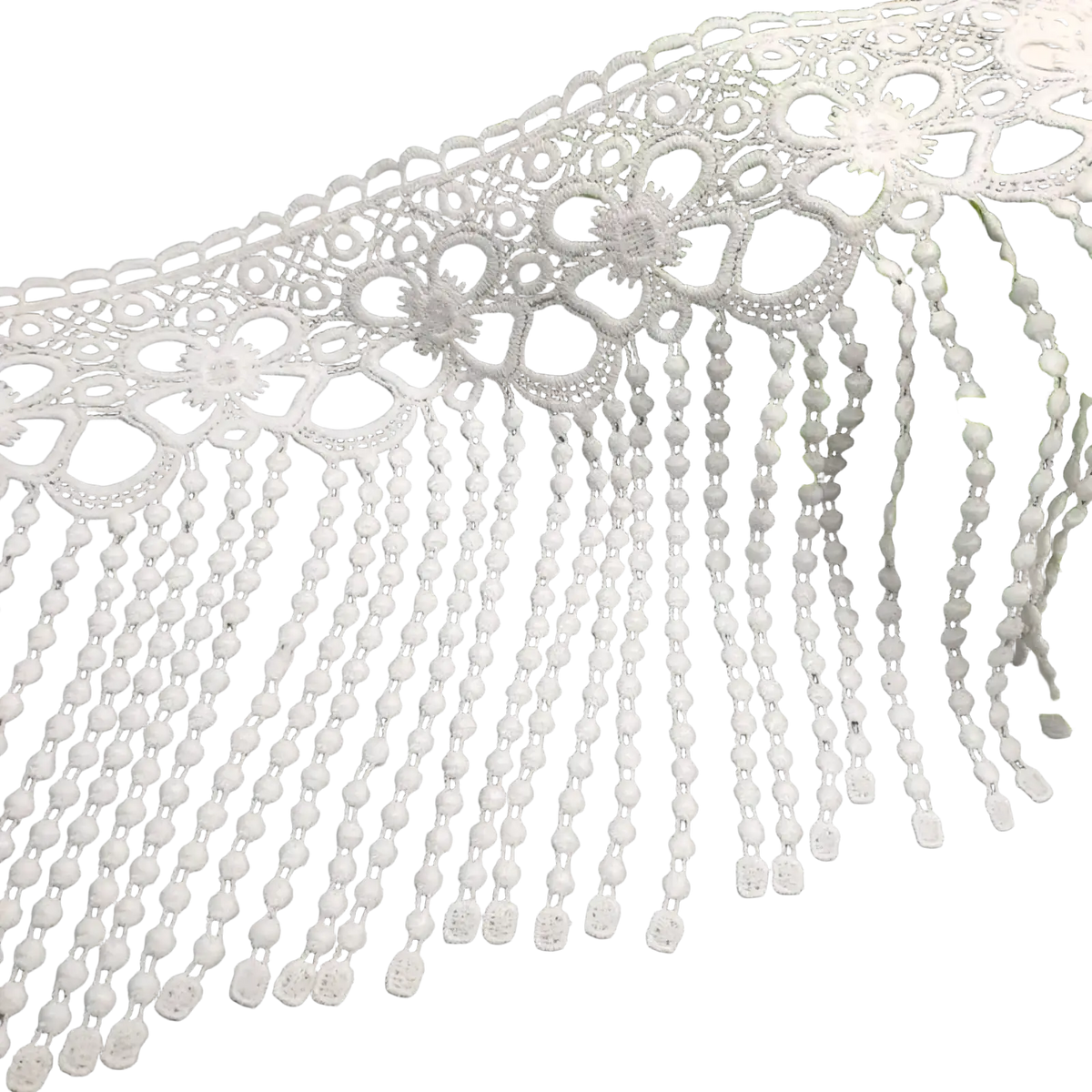 White beaded lace trim fabric featuring white lace with floral patterns and delicate beaded fringe details