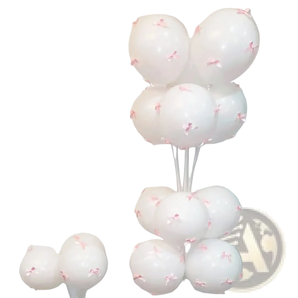 A cluster of white latex balloons decorated with tiny pink bows for elegant party decoration