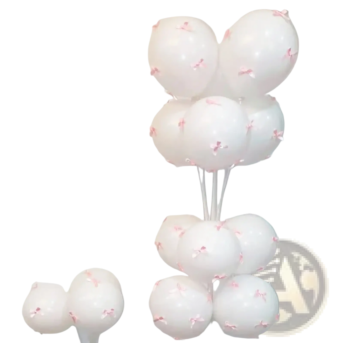 A cluster of white latex balloons decorated with tiny pink bows for elegant party decoration