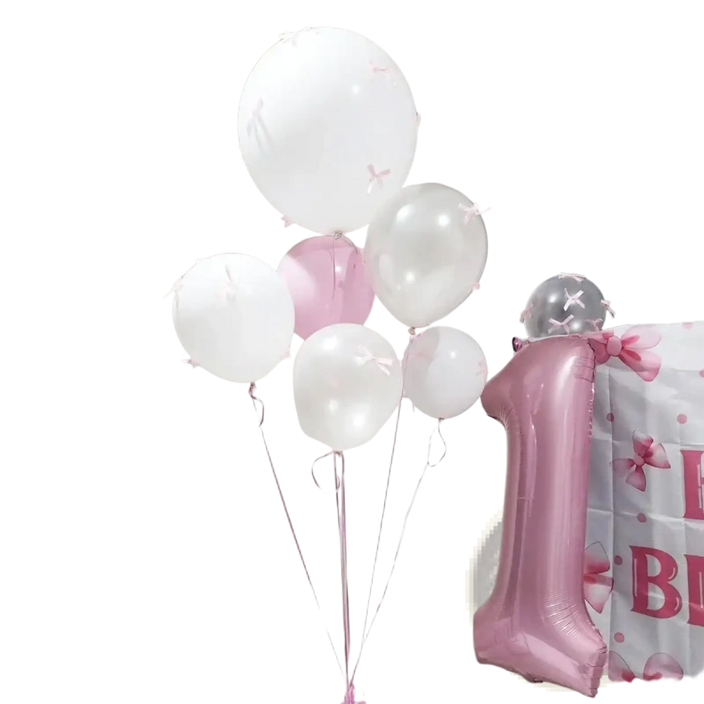 A pink metallic number one balloon included in a white bow balloon set with pink ribbons for party decor