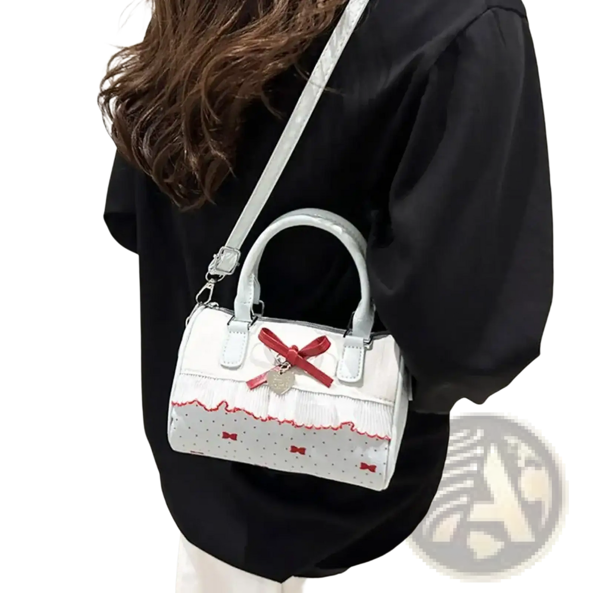 White bow crossbody pu leather handbag with silver handles ruffled trim and red bow accents on the front