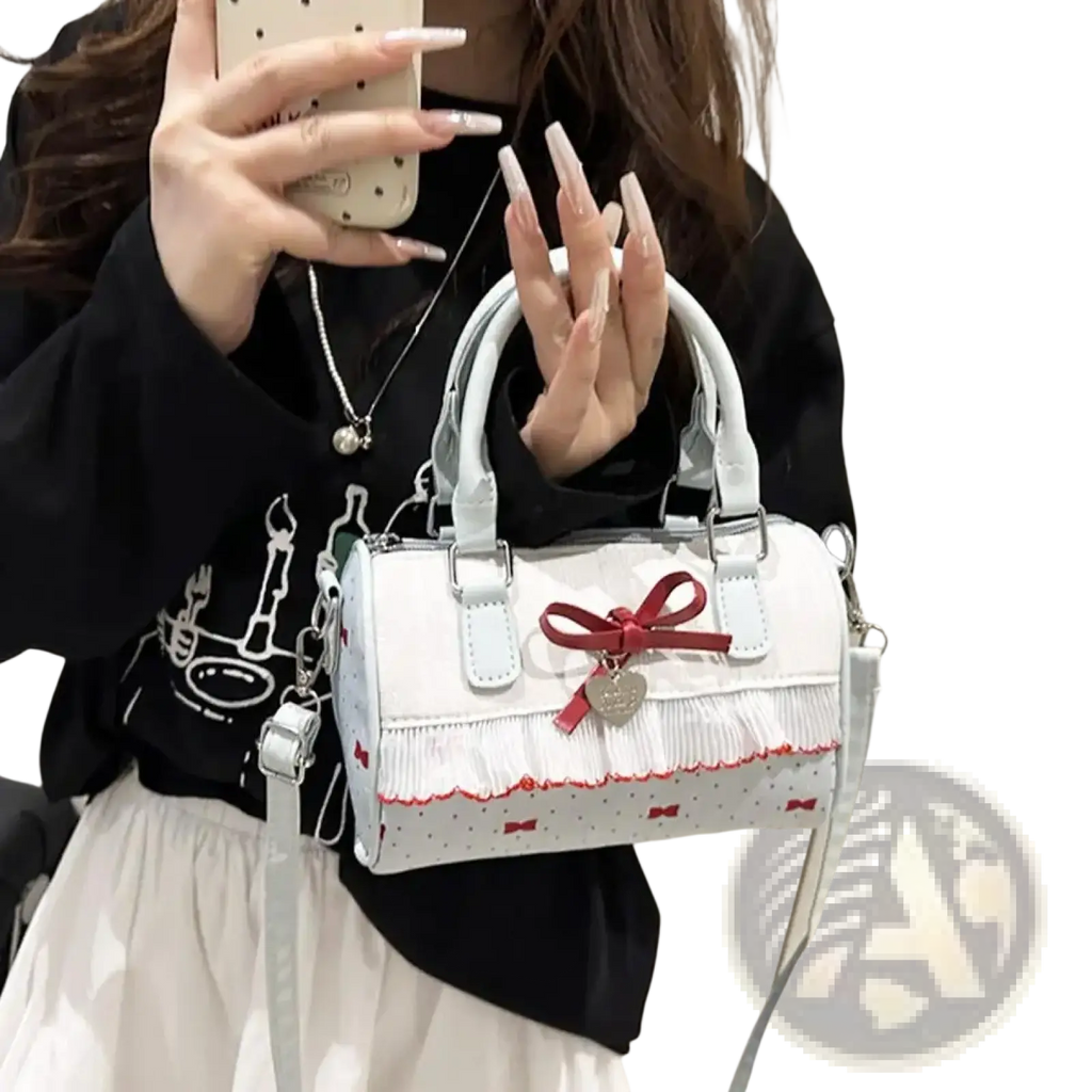 White bow crossbody pu leather handbag featuring red bow and polka dot detailing for stylish use