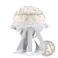White bridal bouquet of ivory satin roses adorned with rhinestones and tied with a sheer lace ribbon bow