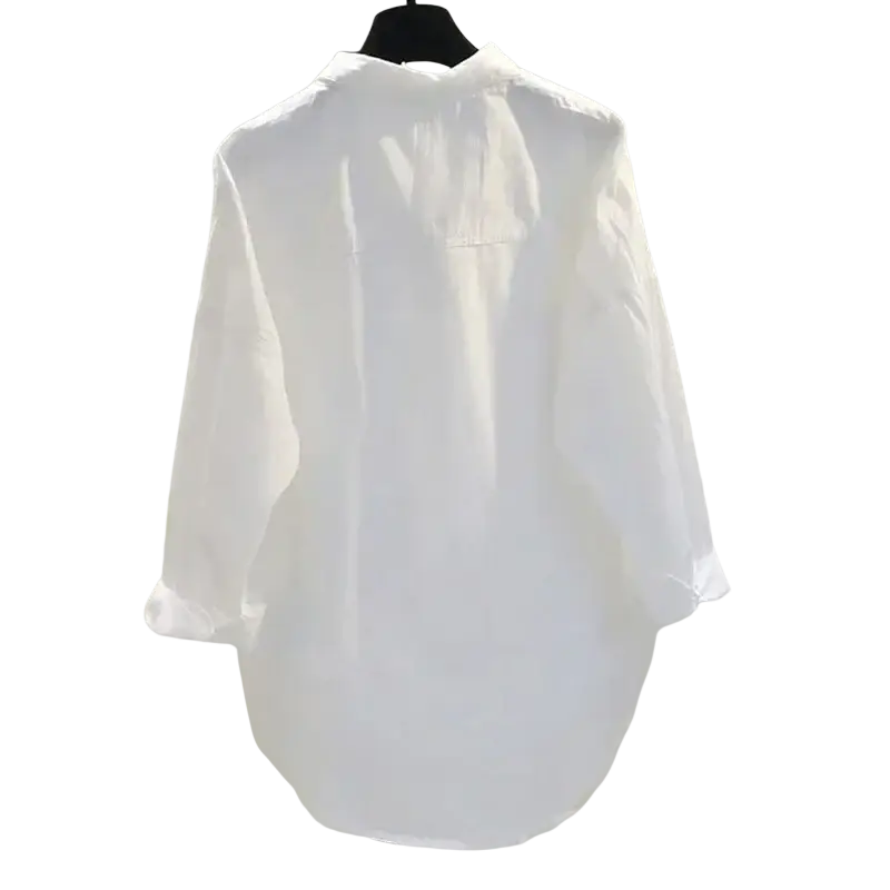 White button down office blouse for women featuring a crisp white lightweight linen fabric with a relaxed fit and 3 quarter length sleeves 18 inch 46 cm